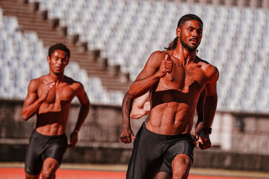 Sprinters at full effort on a track
