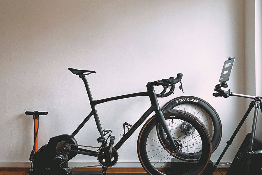 A road bike set up on an indoor trainer